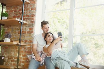 Image showing Young couple moved to a new house or apartment