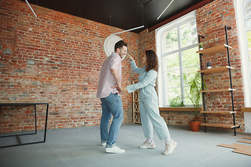 Image showing Young couple moved to a new house or apartment