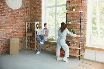 Image showing Young couple moved to a new house or apartment