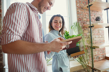 Image showing Young couple moved to a new house or apartment