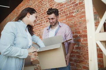 Image showing Young couple moved to a new house or apartment