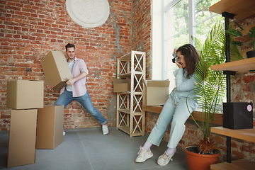 Image showing Young couple moved to a new house or apartment