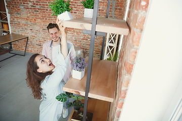 Image showing Young couple moved to a new house or apartment