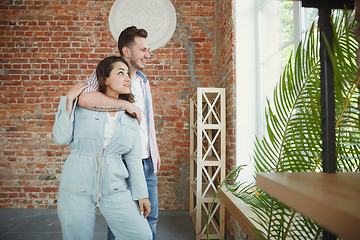 Image showing Young couple moved to a new house or apartment