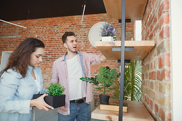 Image showing Young couple moved to a new house or apartment