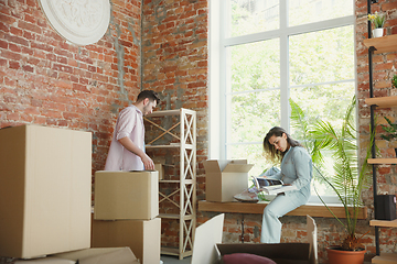 Image showing Young couple moved to a new house or apartment