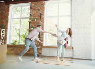 Image showing Young couple moved to a new house or apartment