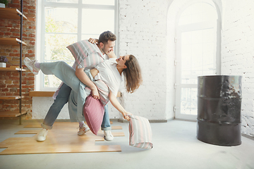 Image showing Young couple moved to a new house or apartment