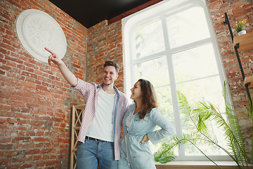 Image showing Young couple moved to a new house or apartment