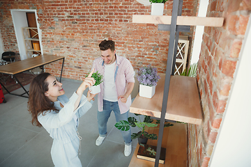 Image showing Young couple moved to a new house or apartment