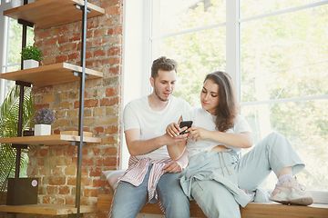 Image showing Young couple moved to a new house or apartment