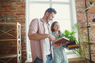 Image showing Young couple moved to a new house or apartment