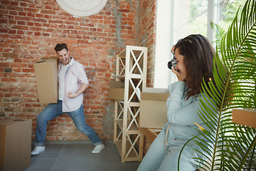 Image showing Young couple moved to a new house or apartment