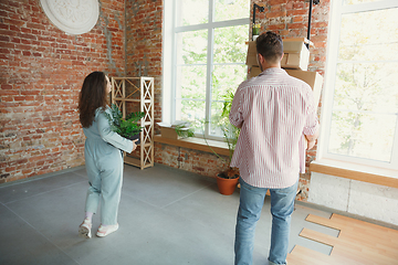 Image showing Young couple moved to a new house or apartment