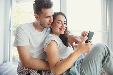 Image showing Young couple moved to a new house or apartment