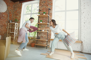 Image showing Young couple moved to a new house or apartment