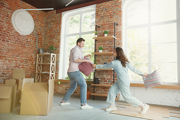 Image showing Young couple moved to a new house or apartment