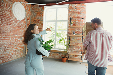 Image showing Young couple moved to a new house or apartment