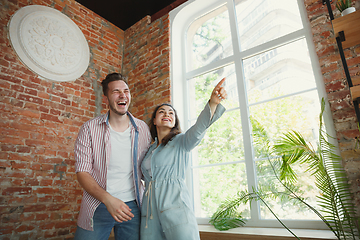 Image showing Young couple moved to a new house or apartment