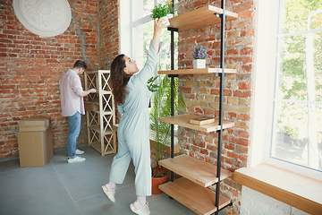 Image showing Young couple moved to a new house or apartment