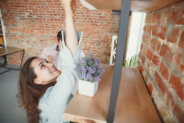 Image showing Young couple moved to a new house or apartment