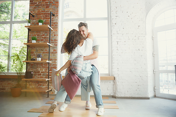 Image showing Young couple moved to a new house or apartment