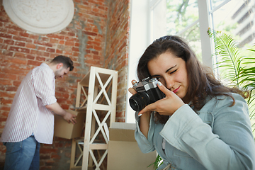 Image showing Young couple moved to a new house or apartment