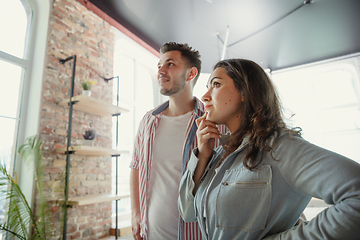 Image showing Young couple moved to a new house or apartment