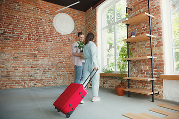 Image showing Young couple moved to a new house or apartment