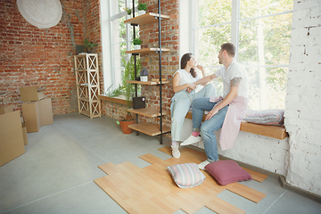 Image showing Young couple moved to a new house or apartment