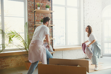 Image showing Young couple moved to a new house or apartment