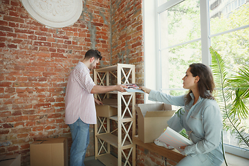 Image showing Young couple moved to a new house or apartment