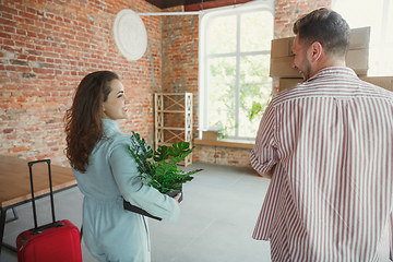 Image showing Young couple moved to a new house or apartment