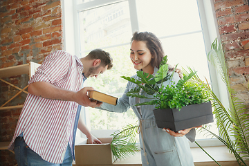 Image showing Young couple moved to a new house or apartment