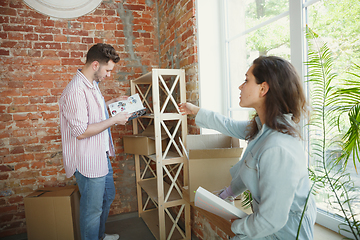 Image showing Young couple moved to a new house or apartment