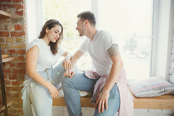 Image showing Young couple moved to a new house or apartment