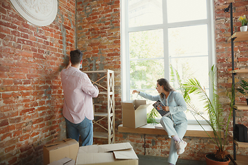 Image showing Young couple moved to a new house or apartment