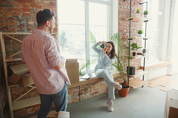 Image showing Young couple moved to a new house or apartment