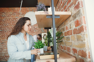 Image showing Young couple moved to a new house or apartment