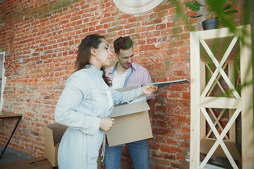 Image showing Young couple moved to a new house or apartment