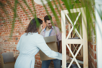 Image showing Young couple moved to a new house or apartment