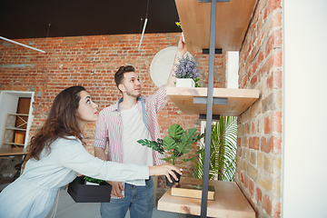 Image showing Young couple moved to a new house or apartment