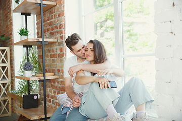 Image showing Young couple moved to a new house or apartment