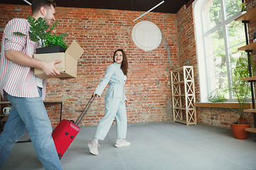 Image showing Young couple moved to a new house or apartment