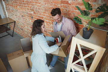 Image showing Young couple moved to a new house or apartment