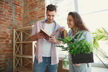 Image showing Young couple moved to a new house or apartment