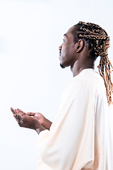 Image showing african man pray to Allah