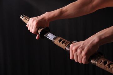 Image showing Man holding samurai sword