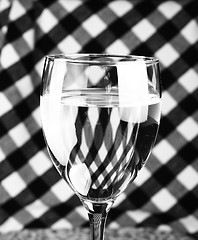 Image showing Glass against checkerboard pattern