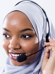 Image showing african customer representative business woman with phone headse